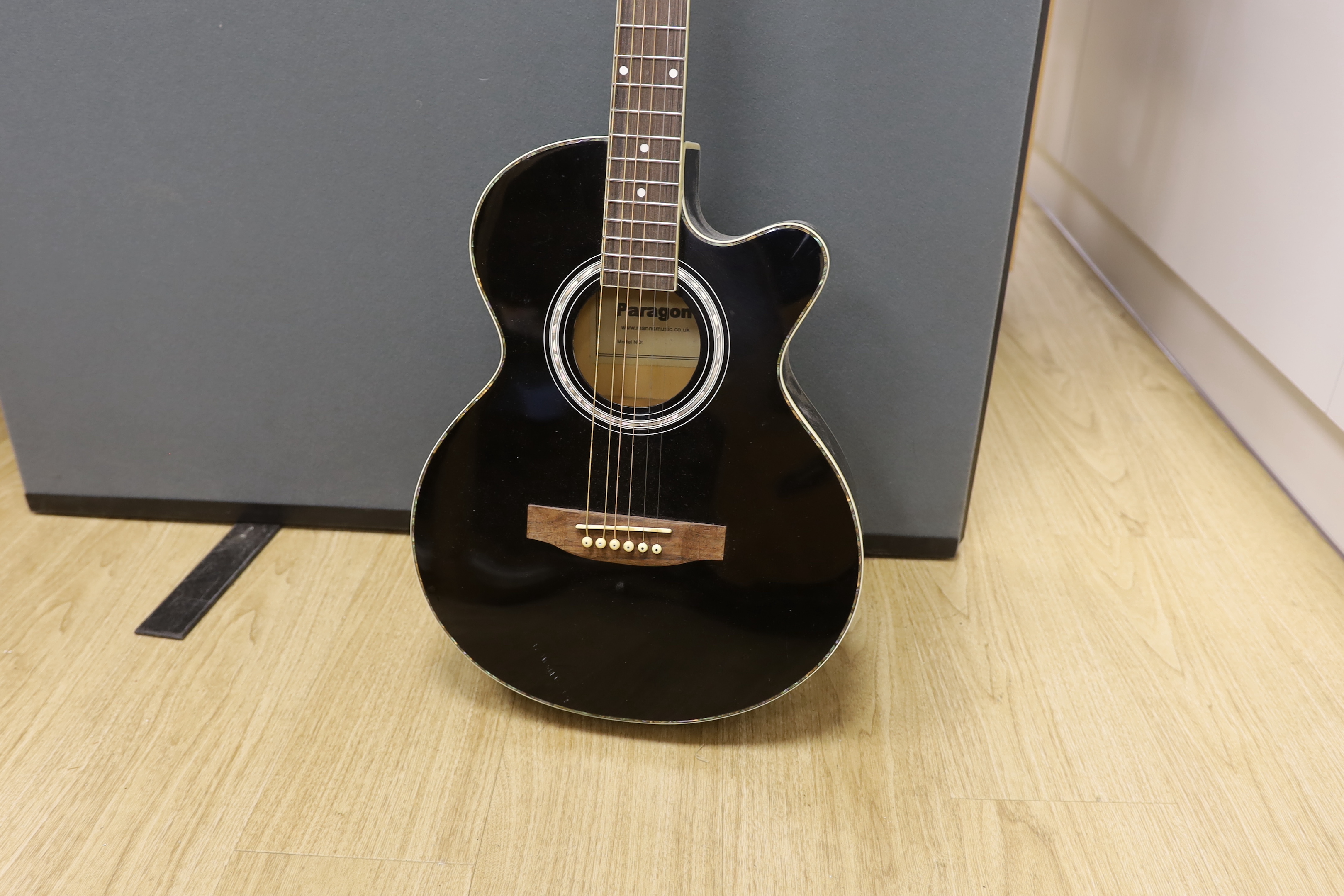 A Paragon electro-acoustic guitar